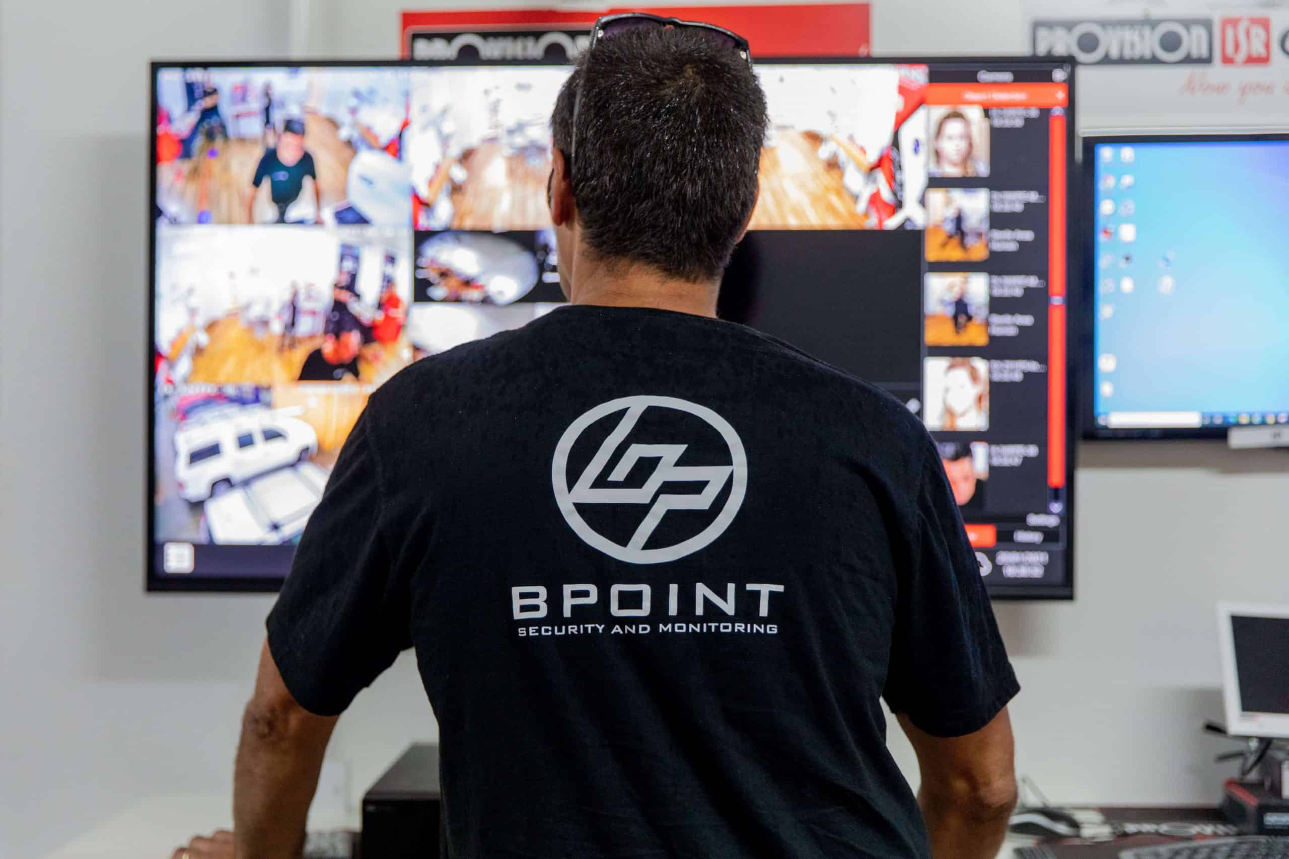 Bpoint technician monitoring a live CCTV wall