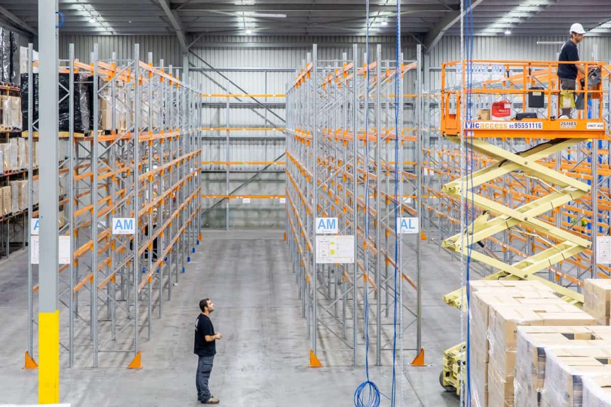 Bpoint technicians installing cameras across a large warehouse
