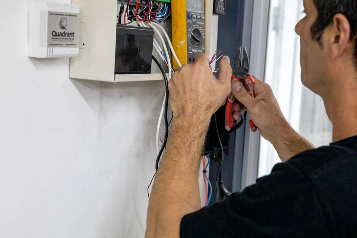 Bpoint technician terminating cabling inside a security enclosure
