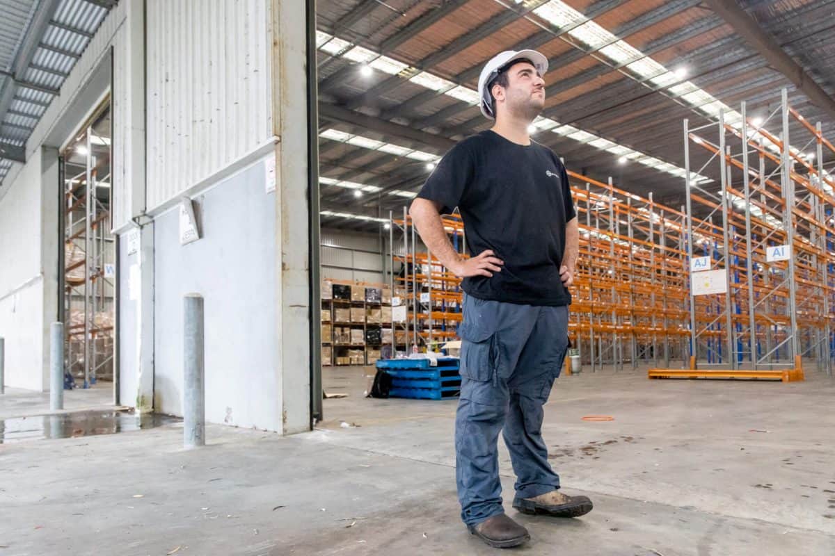 Bpoint technician assessing a warehouse before system design