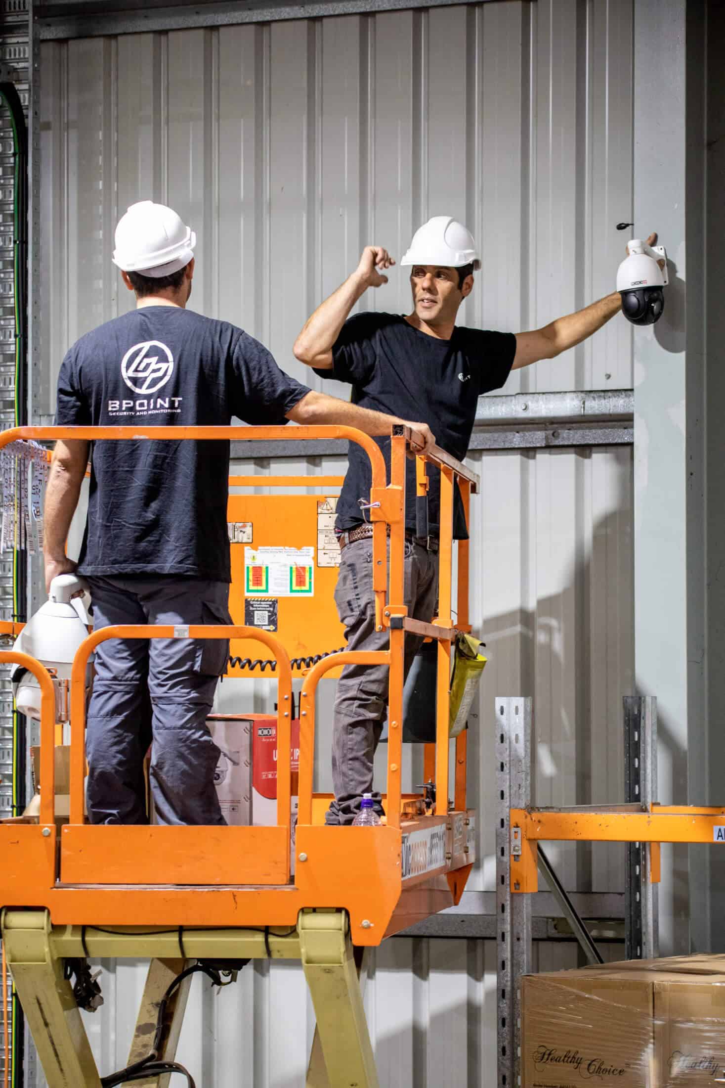 Two BPoint workers installing CCTV