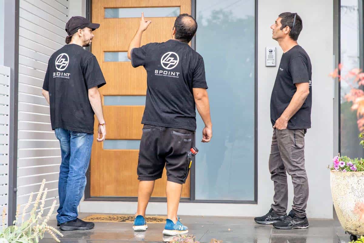 Technicians planning security camera installation